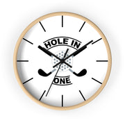 The Hole In One Golf Wall Clock — Golfers’ Decorative Clock features a light wood frame, crossed golf clubs, a golf ball at the center, and bold "HOLE IN ONE" lettering—perfect for adding a sporty touch to any space.