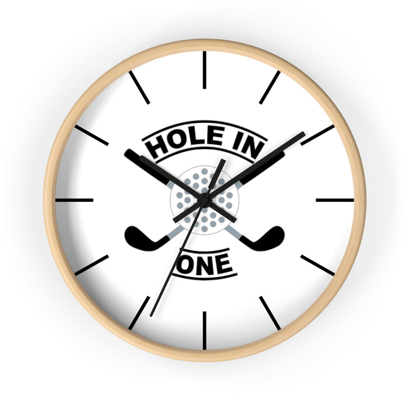 The Hole In One Golf Wall Clock — Golfers’ Decorative Clock features a light wood frame, crossed golf clubs, a golf ball at the center, and bold "HOLE IN ONE" lettering—perfect for adding a sporty touch to any space.