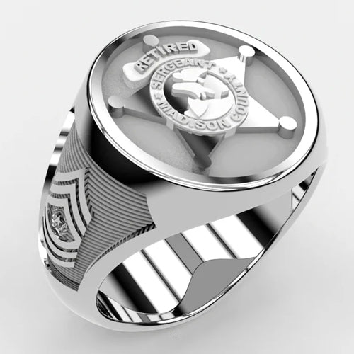 The Police Ring - 519A Style is a sterling silver ring with a raised sheriff badge design. Text blocks and side panels allow the ring to be customized.