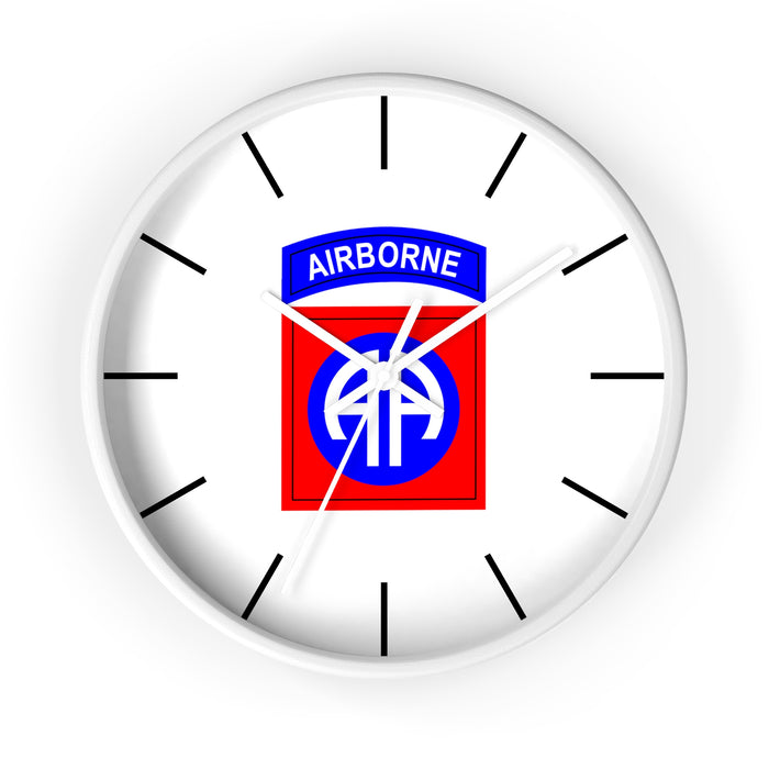 The 82nd Airborne Wall Clock, showcasing the insignia of the U.S. Army's 82nd Airborne Division at its center, includes a blue "AIRBORNE" tab at the top and a red square with a blue and white "AA" symbol. Perfect for creating a personalized atmosphere, it features black hour markers and hands.