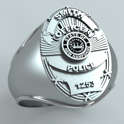 The Police Ring - M263B Style is a sterling silver ring featuring a badge design with "Smith Officer," "State of New Hampshire," and "Police 1253." The customized badge shape is enhanced by stars and intricate engravings.