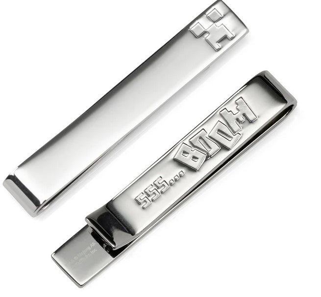 The Minecraft Creeper Hidden Message Silver Tie Bar features a pixelated creeper face and hidden engraved details—making it the perfect silver accessory for any gamer and a stylish nod to the iconic Minecraft video game.