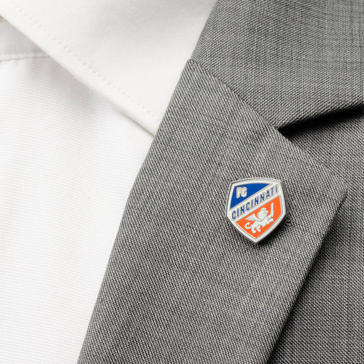 FC Cincinnati Lapel Pin pictured on the lapel on a suit jacket.