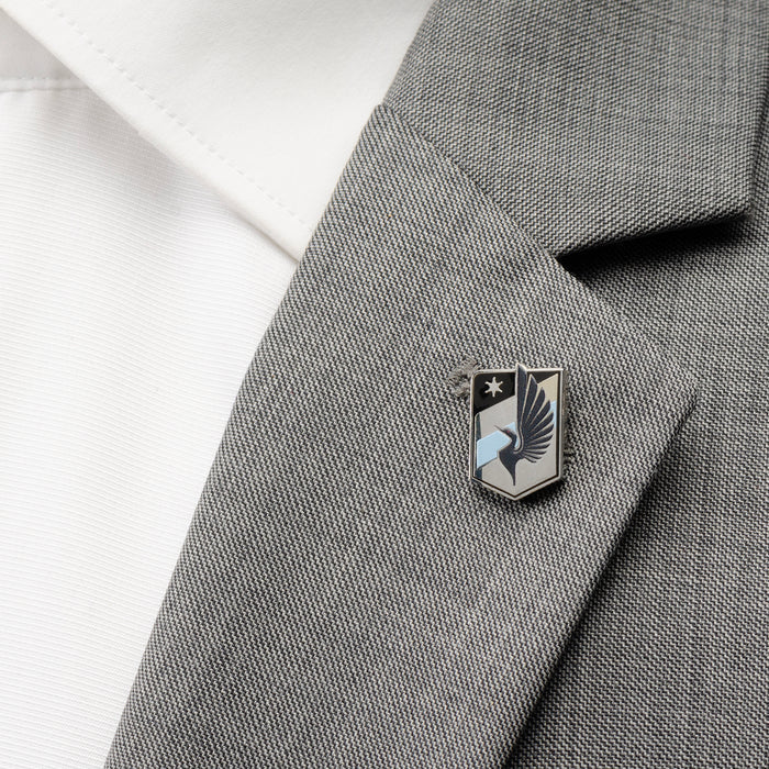 Minnesota United FC Lapel Pin pictured on the lapel on a suit jacket.