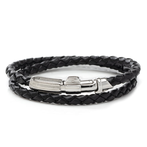 The Darth Vader Lightsaber Bracelet is a black braided leather accessory that features a metallic clasp shaped like a sci-fi blaster. Reminiscent of Darth Vader's elegance, the bracelet wraps around your wrist, showcasing the intricate weaves of the leather and the detailed design of the clasp.