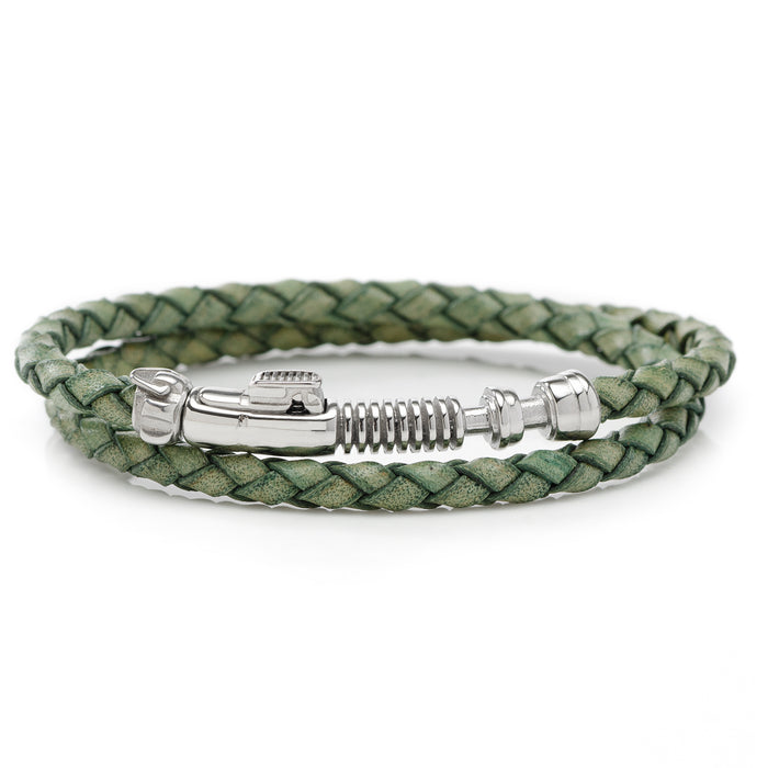 Introducing the Luke Skywalker Lightsaber Bracelet: a green, braided leather bracelet featuring a silver clasp styled like a wrench. Designed to wrap around your wrist twice, this accessory showcases intricate detailing that mimics mechanical components, evoking the craftsmanship of Luke Skywalker's iconic lightsaber.