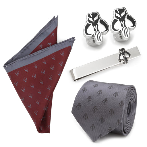 Introducing the Ultimate The Mandalorian Gift Set: a collection of formal men's accessories featuring a folded pocket square, a pair of cufflinks, a tie bar, and a necktie. Each piece is adorned with small patterned designs resembling skull-like emblems. The maroon and gray pocket square complements the gray tie perfectly.