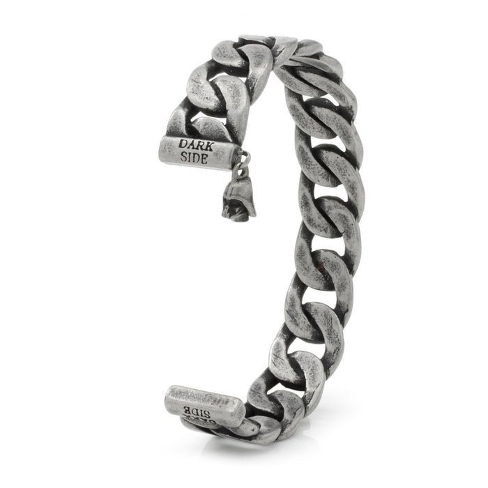 Introducing the Darth Vader Chain Link Stainless Steel Bracelet: a robust, chunky accessory featuring a thick interlocking chain design. The slightly curved bracelet showcases an engraved clasp with the text "DARK SIDE," inspired by Darth Vader, and includes a small dangling charm for added flair.