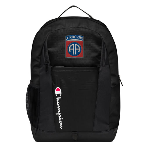 The 82nd Airborne Champion Backpack in black showcases a "Champion" logo, a mesh side pocket, a top handle and a 82nd Airborne logo on the front. Crafted from water-resistant material, this sports backpack is ideal for all-weather use.