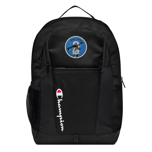 The Navy Seal Team 2 Champion Backpack in black showcases a "Champion" logo, a mesh side pocket, a top handle and a Navy Seal Team 2 logo on the front. Crafted from water-resistant material, this sports backpack is ideal for all-weather use.