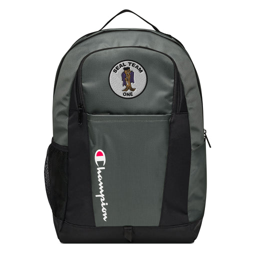 The Seal Team 1 Champion Backpack in gray and black showcases a "Champion" logo, a mesh side pocket, a top handle and a Seal Team 1 logo on the front. Crafted from water-resistant material, this sports backpack is ideal for all-weather use.