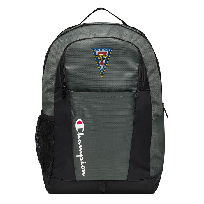 The Navy Seal Team 7 Champion Backpack in gray and black showcases a "Champion" logo, a mesh side pocket, a top handle and a Navy Seal Team 7 logo on the front. Crafted from water-resistant material, this sports backpack is ideal for all-weather use.