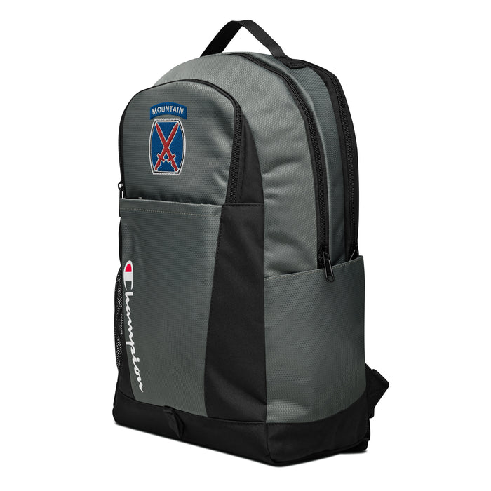 The 10th Mountain Division Champion Backpack, viewed from a right side tilt, features multiple compartments including a front pocket.