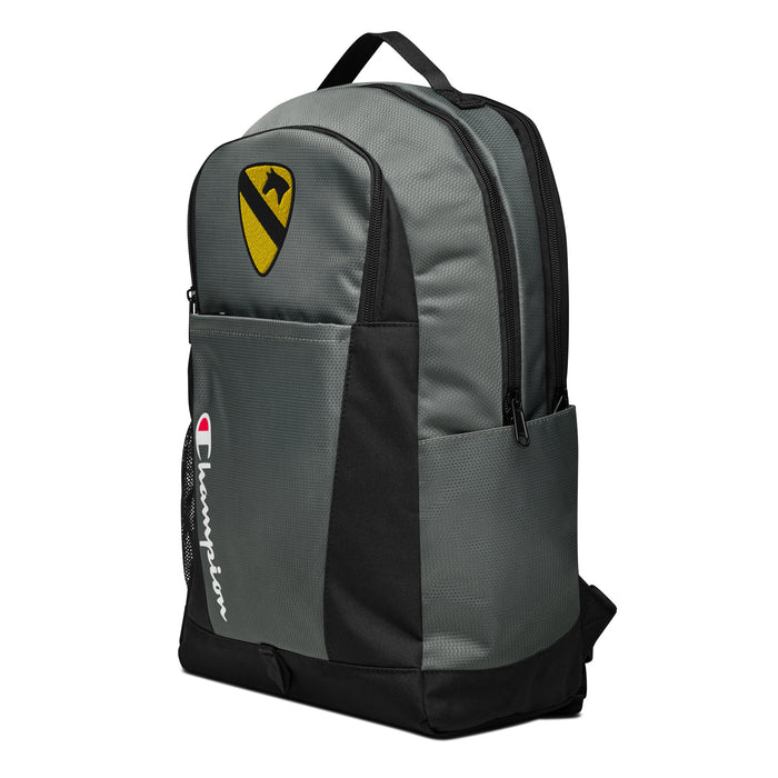 The 1st Cavalry Division Champion Backpack, viewed from a right side tilt, features multiple compartments including a front pocket.