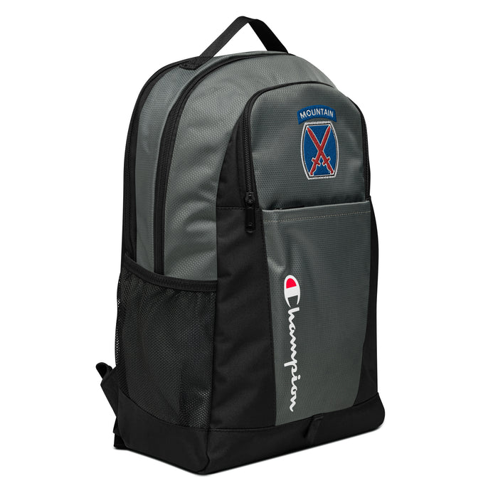 The 10th Mountain Division Champion Backpack, viewed from a left side tilt, shows multiple compartments including a front pocket .