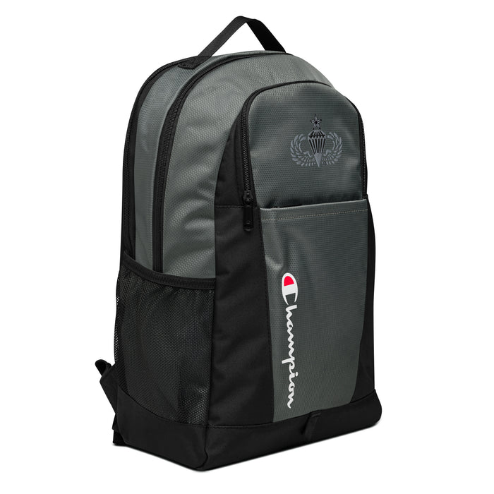 The Senior Parachutist Champion Backpack, viewed from a left side tilt, shows multiple compartments including a front pocket .