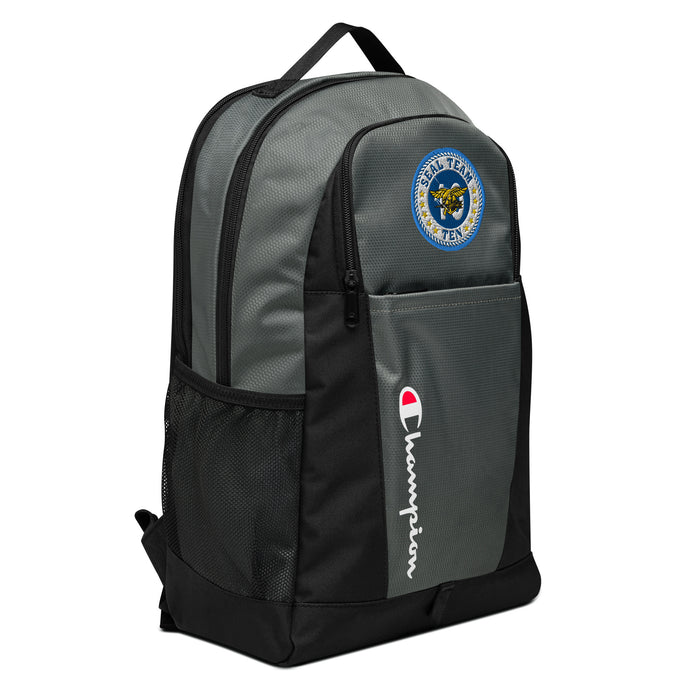 The Navy Seal Team 10 Champion Backpack, viewed from a left side tilt, shows multiple compartments including a front pocket .