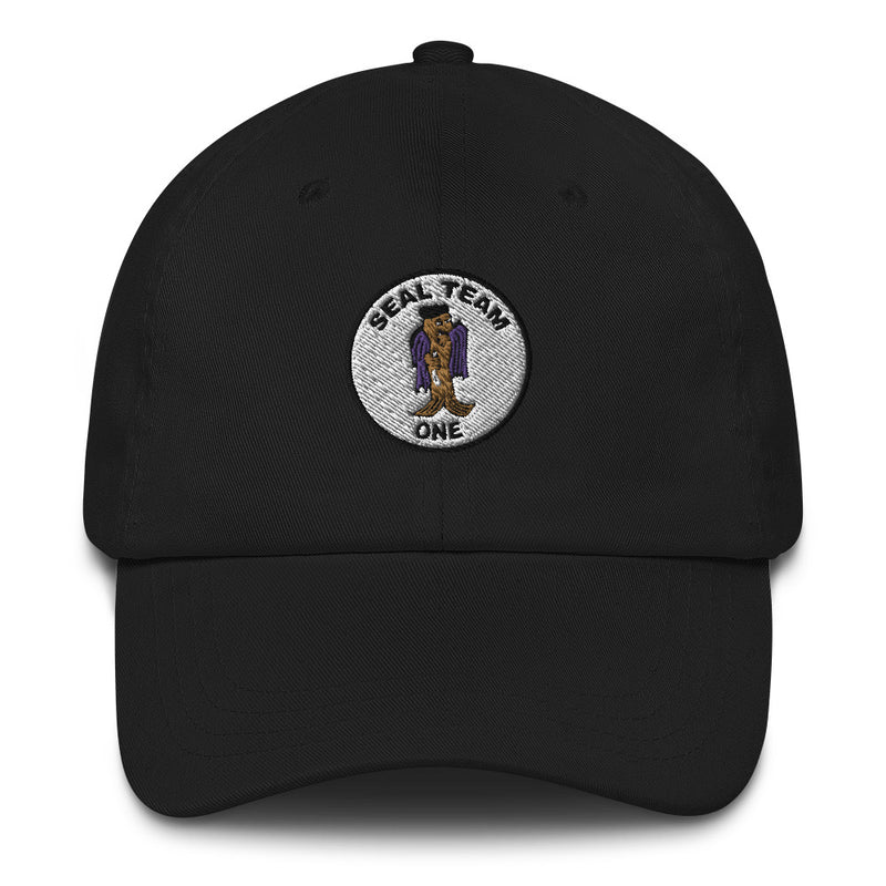 A black Seal Team 1 Hat with the logo on the front.  The hat has a curved visor and an adjustable strap at the back.