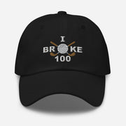 The "I Broke 100" Men's Embroidered Hat is a black, low-profile hat featuring the phrase "I Broke 70" on the front. The word "Broke" is uniquely stylized with a golf ball as the 'O' and crossed golf clubs beneath it.