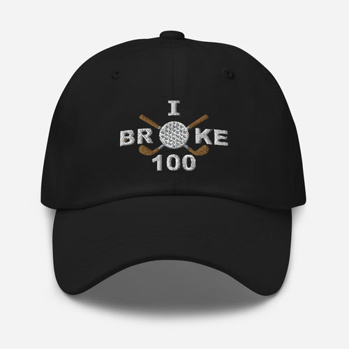 The "I Broke 100" Men's Embroidered Hat is a black, low-profile hat featuring the phrase "I Broke 70" on the front. The word "Broke" is uniquely stylized with a golf ball as the 'O' and crossed golf clubs beneath it.