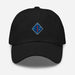 The 1st Marine Division Hat features a black design with a blue diamond-shaped patch on the front, highlighting a red "1" and four white stars in each corner. An adjustable strap ensures a comfortable fit, and it is prominently displayed against a clean white background.