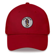 A cranberry colored Seal Team 1 Hat with the logo on the front.  The hat has a curved visor and an adjustable strap at the back.