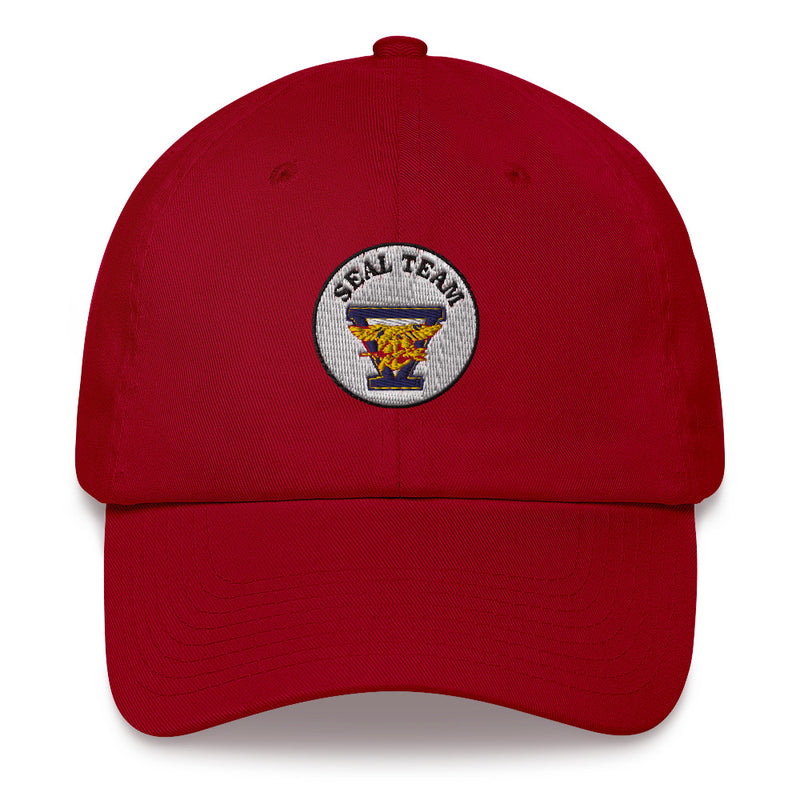 A cranberry colored Seal Team 5 Hat with the logo on the front.  The hat has a curved visor and an adjustable strap at the back.