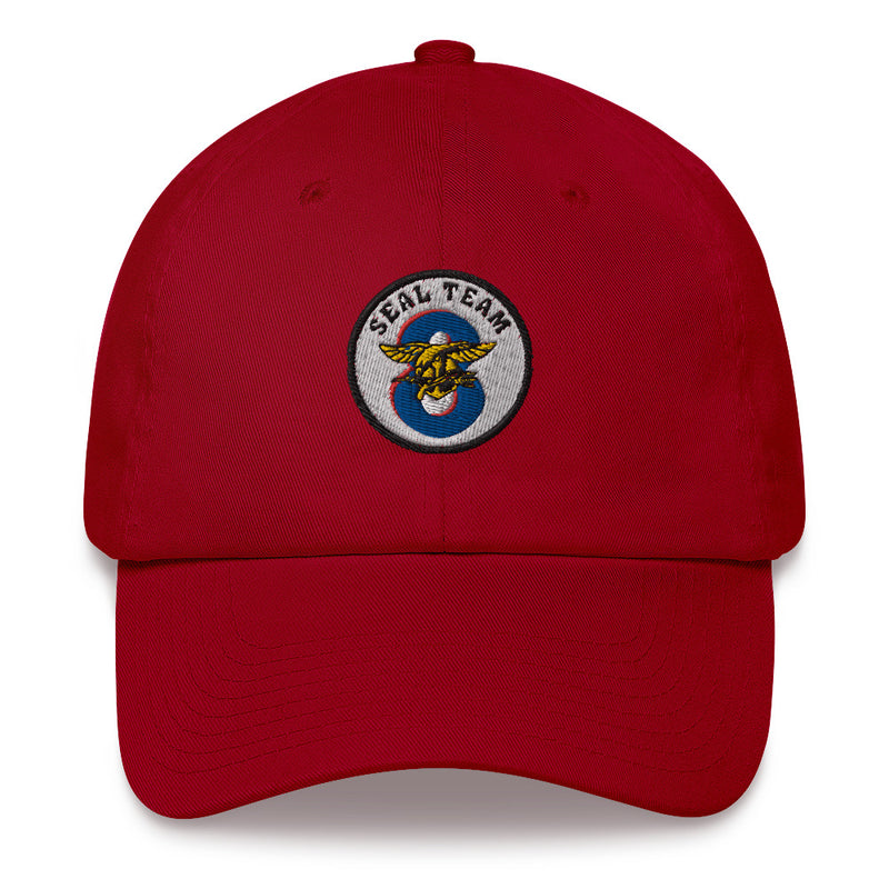 A cranberry colored Seal Team 8 Hat with the logo on the front.  The hat has a curved visor and an adjustable strap at the back.