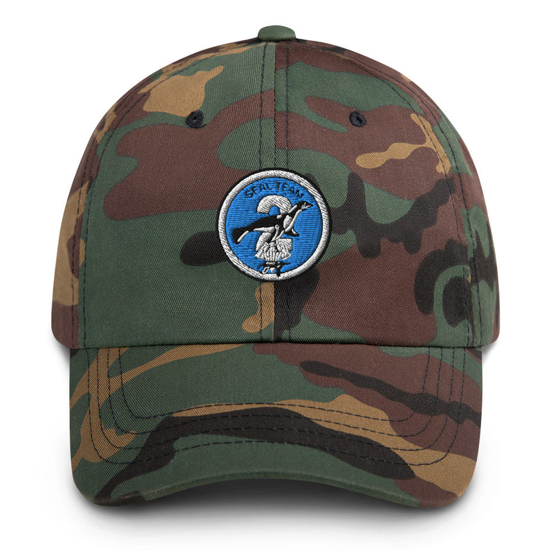 A military style Seal Team 2 Hat with camouflage and the logo on the front.  The hat has a curved visor and an adjustable strap at the back. 