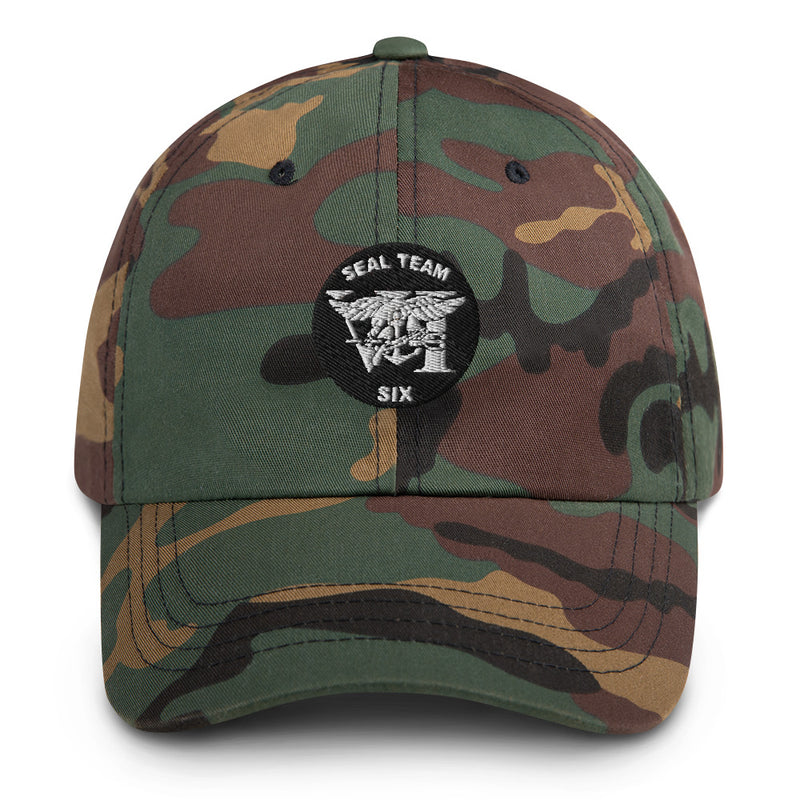 A military style Seal Team 6 Hat with camouflage and the logo on the front.  The hat has a curved visor and an adjustable strap at the back. 