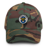 A military style Seal Team 8 Hat with camouflage and the logo on the front.  The hat has a curved visor and an adjustable strap at the back. 