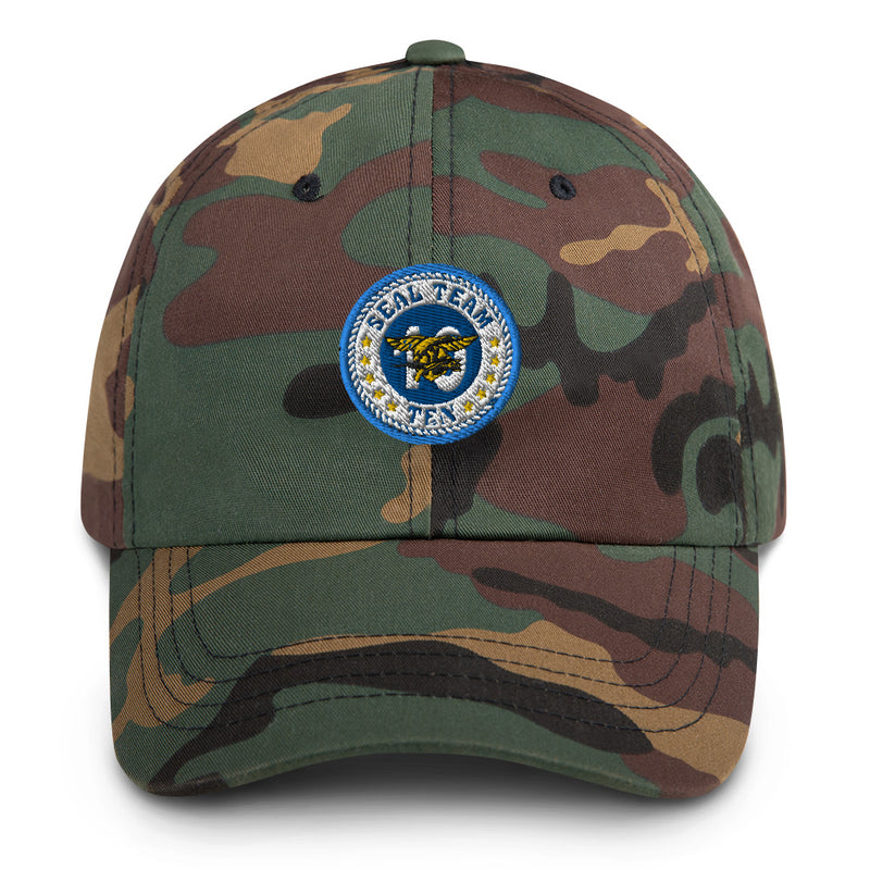 A military style Seal Team 10 Hat with camouflage and the logo on the front.  The hat has a curved visor and an adjustable strap at the back. 