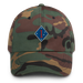 A military style 1st Marine Division Hat with camouflage and the logo on the front.  The hat has a curved visor and an adjustable strap at the back. 
