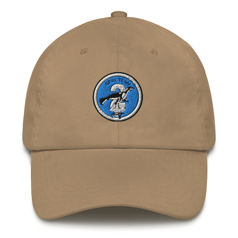 A khaki colored Seal Team 2 Hat with the logo on the front.  The hat has a curved visor and an adjustable strap at the back.
