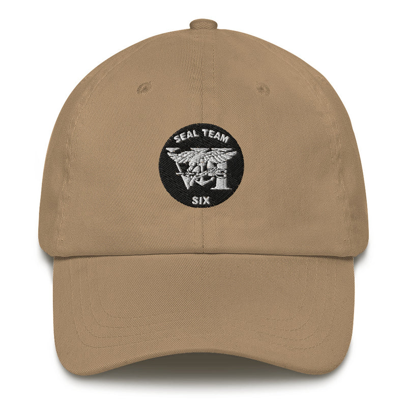A khaki colored Seal Team 6 Hat with the logo on the front.  The hat has a curved visor and an adjustable strap at the back.