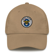 A khaki colored Seal Team 8 Hat with the logo on the front.  The hat has a curved visor and an adjustable strap at the back.