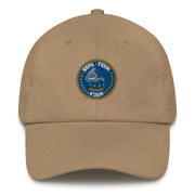 A khaki colored Seal Team 4 Hat with the logo on the front.  The hat has a curved visor and an adjustable strap at the back.