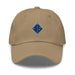 A khaki colored 1st Marine Division Hat with the logo on the front.  The hat has a curved visor and an adjustable strap at the back.
