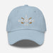 The "I Broke 90" Men's Embroidered Hat is a light blue, low-profile hat featuring the phrase "I Broke 70" on the front. The word "Broke" is uniquely stylized with a golf ball as the 'O' and crossed golf clubs beneath it.