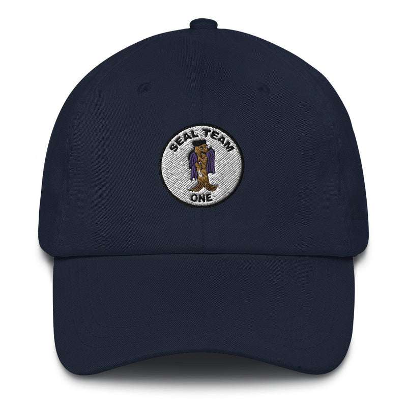 A navy blue Seal Team 1 Hat with the logo on the front.  The hat has a curved visor and an adjustable strap at the back.
