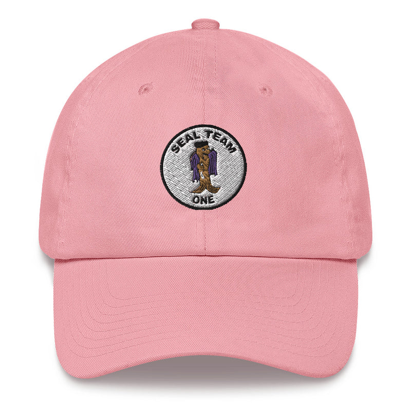 A pink Seal Team 1 Hat with the logo on the front.  The hat has a curved visor and an adjustable strap at the back.