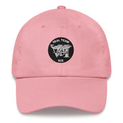 A pink Seal Team 6 Hat with the logo on the front.  The hat has a curved visor and an adjustable strap at the back.