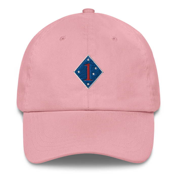 A pink 1st Marine Division Hat with the logo on the front.  The hat has a curved visor and an adjustable strap at the back.
