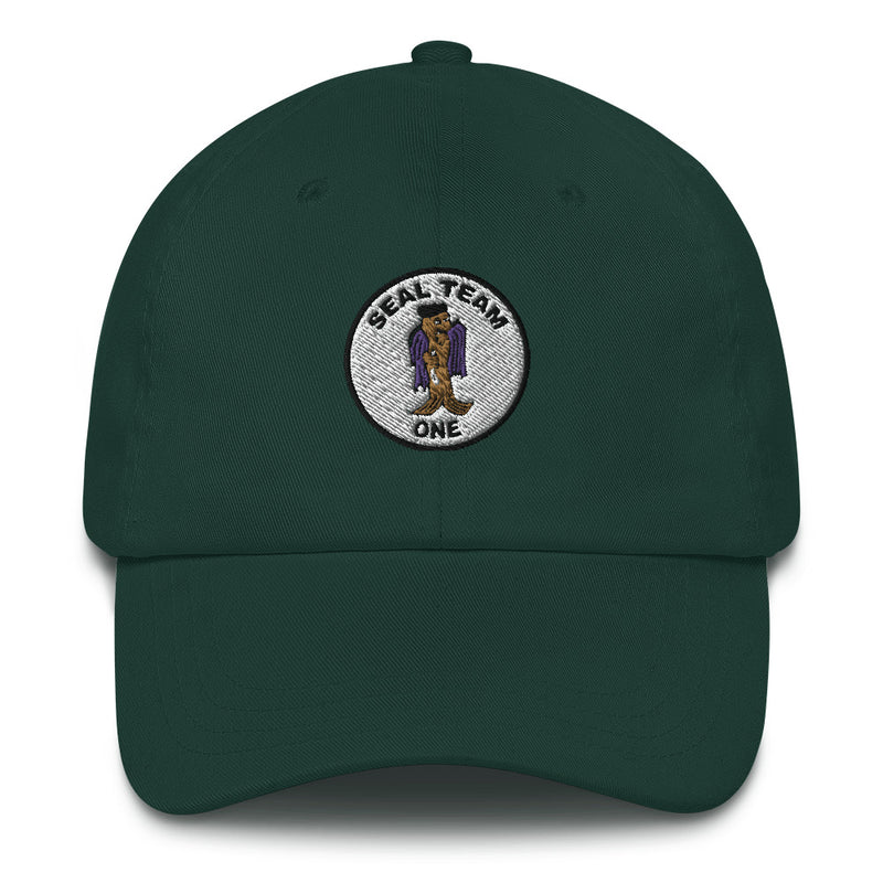 A spruce colored Seal Team 1 Hat with the logo on the front.  The hat has a curved visor and an adjustable strap at the back.