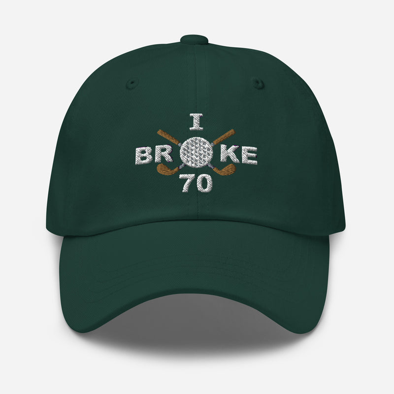 The "I Broke 70" Men's Embroidered Hat is a spruce colored, low-profile hat featuring the phrase "I Broke 70" on the front. The word "Broke" is uniquely stylized with a golf ball as the 'O' and crossed golf clubs beneath it.