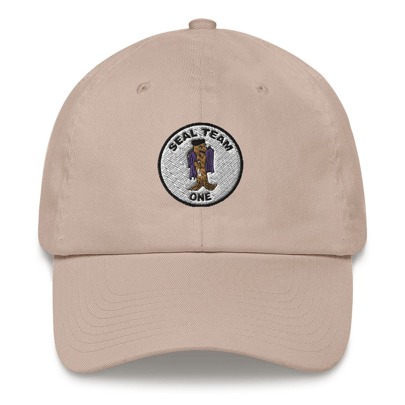 A stone colored Seal Team 1 Hat with the logo on the front.  The hat has a curved visor and an adjustable strap at the back.