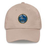 A stone colored Seal Team 4 Hat with the logo on the front.  The hat has a curved visor and an adjustable strap at the back.