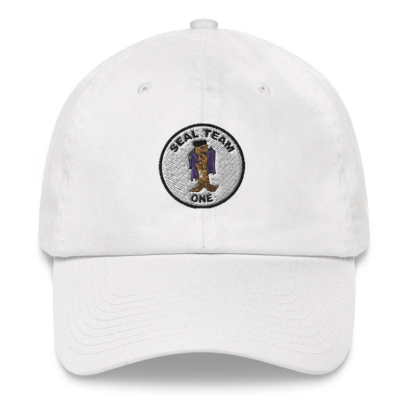A white Seal Team 1 Hat with the logo on the front.  The hat has a curved visor and an adjustable strap at the back.