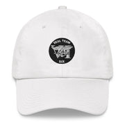 A white Seal Team 6 Hat with the logo on the front.  The hat has a curved visor and an adjustable strap at the back.