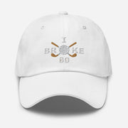 The "I Broke 80" Men's Embroidered Hat is a white, low-profile hat featuring the phrase "I Broke 70" on the front. The word "Broke" is uniquely stylized with a golf ball as the 'O' and crossed golf clubs beneath it.